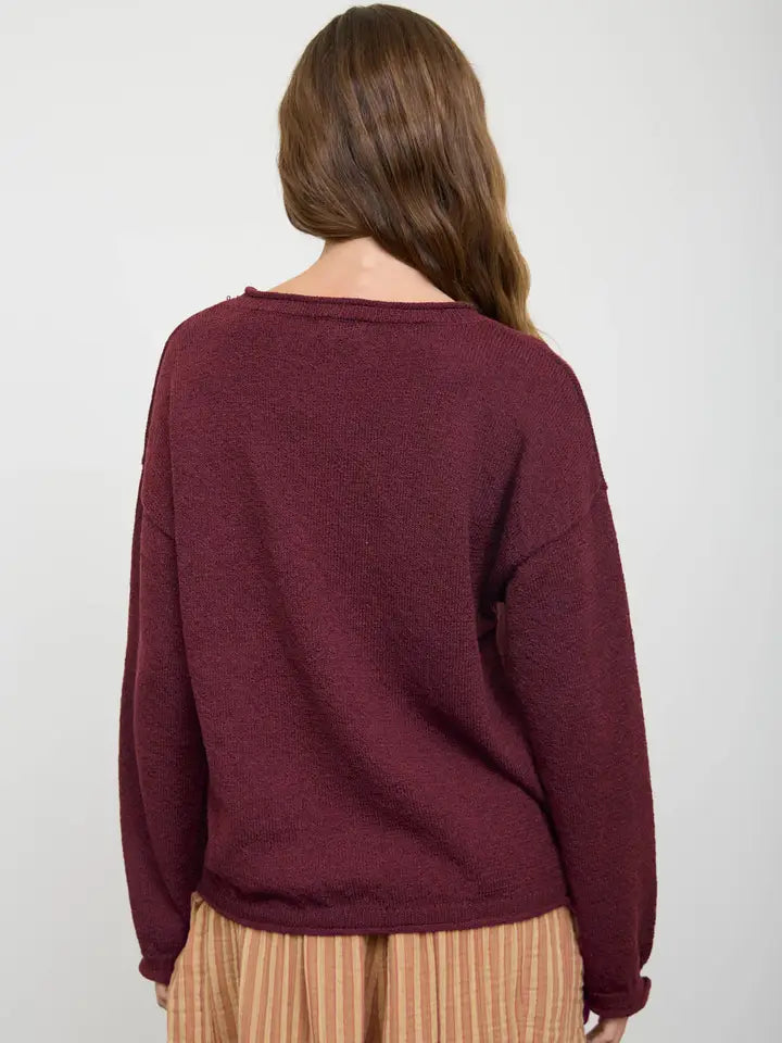 Textured raw edge long sleeve sweater